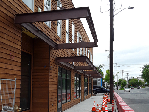 Metal canopies installed on the facade of a building